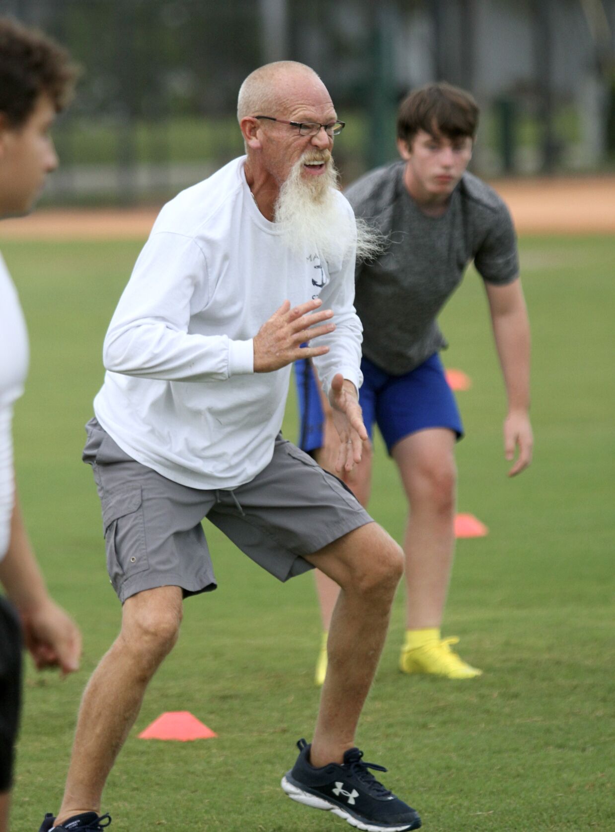 "Stars Aligned" 2. Coach Montgomery shows his player how to do the up-down drill..jpeg